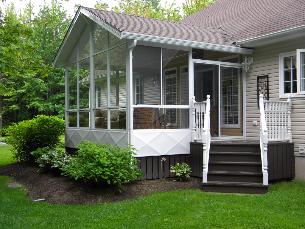 sunroom with small staircase to backyard
