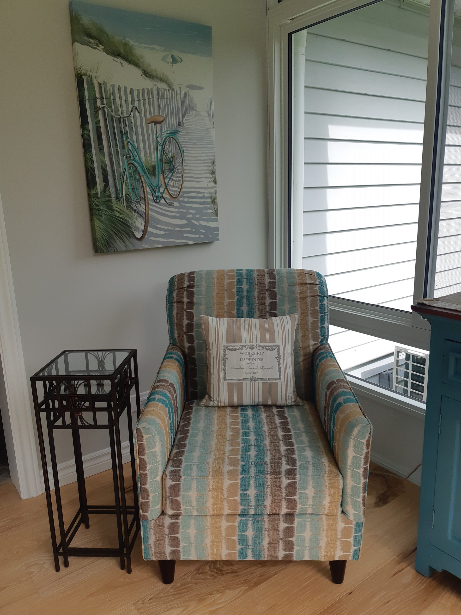 a chair sitting in the corner of a sunroom
