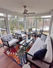 Interior of sunroom with seating and furniture